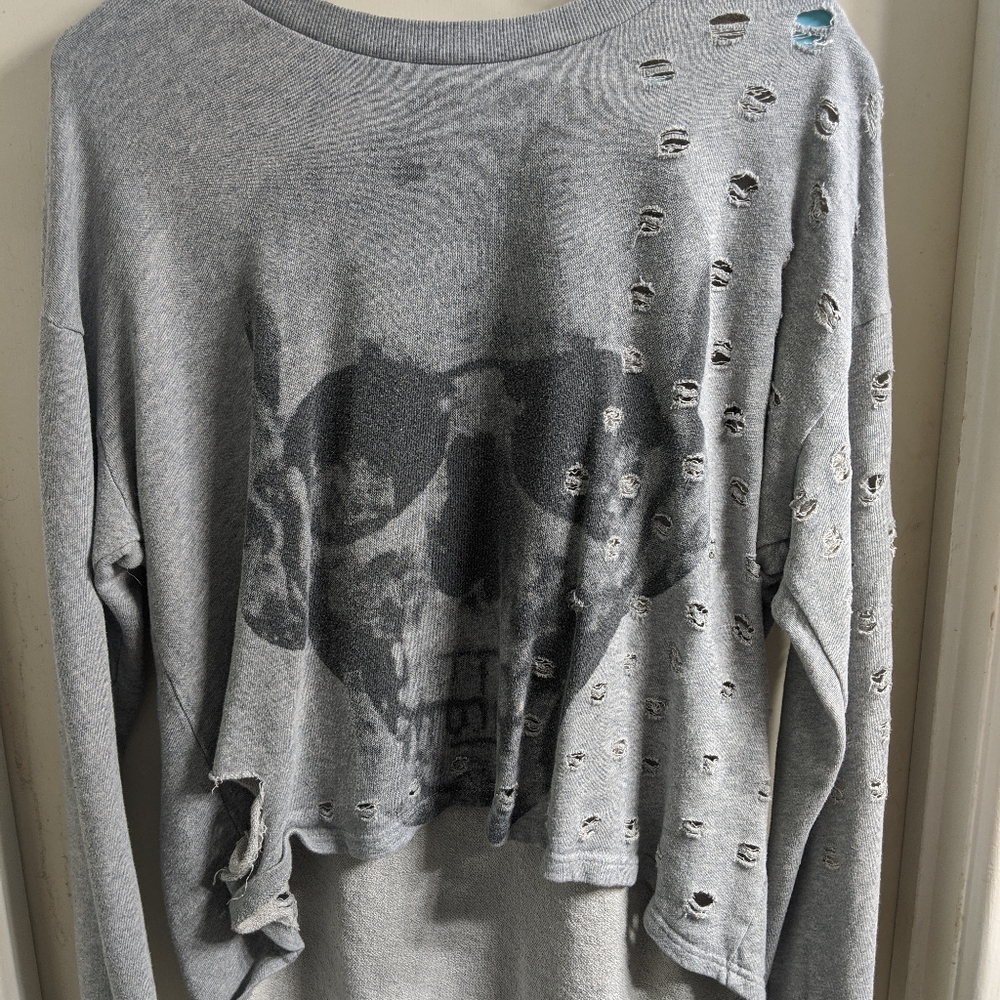 Distressed skull high-low sweater
